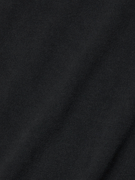 Close-up view of the Daria Oversized Cropped Tee in black, crafted from Supima cotton with a subtle diagonal weave pattern and a soft texture, accented by gentle shadows and highlights.