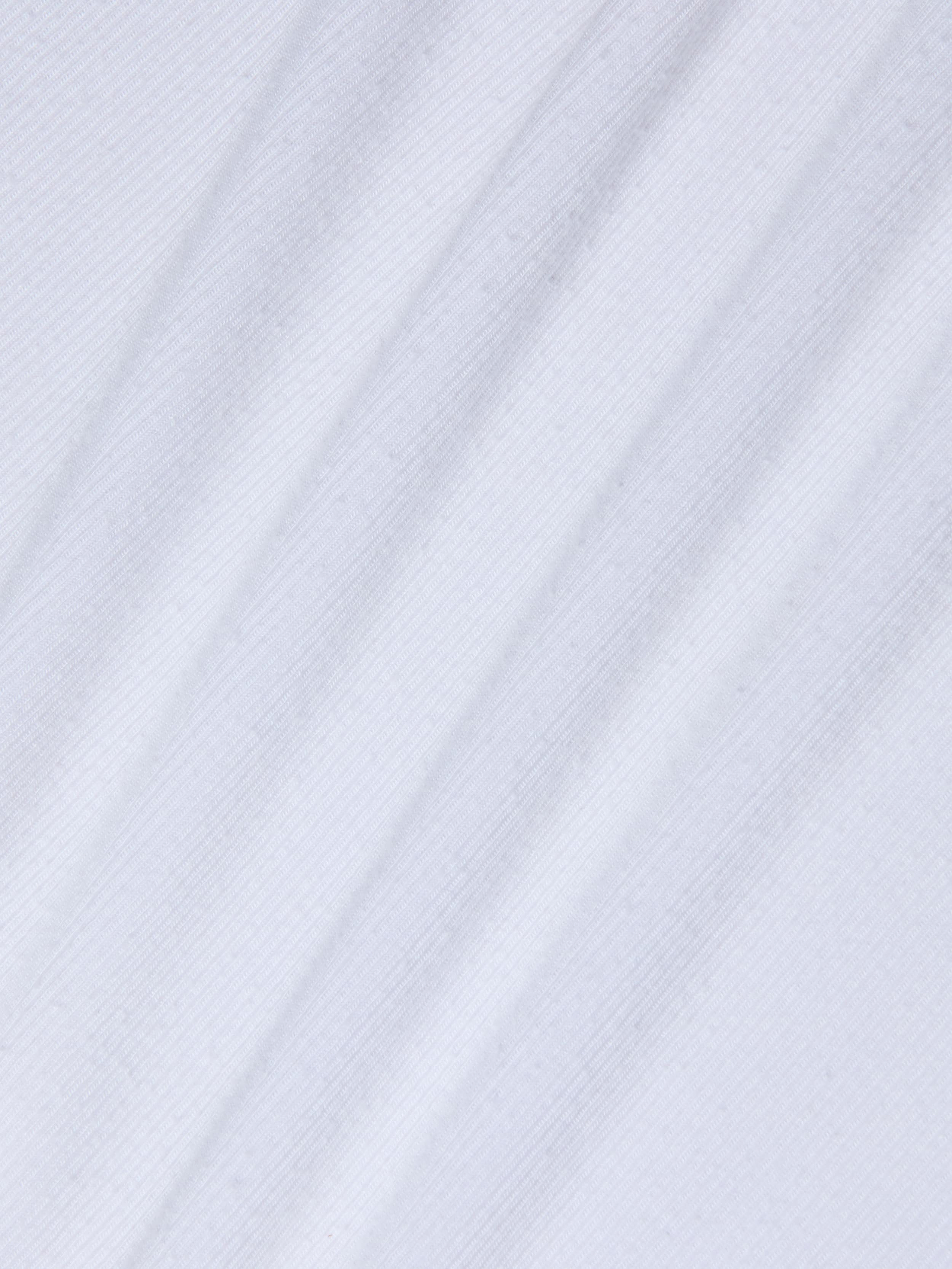White fabric with a diagonal ribbed texture creates subtle shadow lines across the material. The ribbed knit of the Cole Scoopneck Tank suggests a soft, lightweight textile—likely cotton or a cotton blend—making it ideal for an essential scoopneck style.