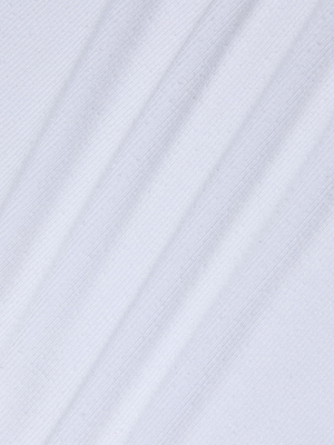 Close-up of ribbed knit white fabric with diagonal texture and soft folds, creating gentle shadows—an ideal choice for the Cole Scoopneck Tank.