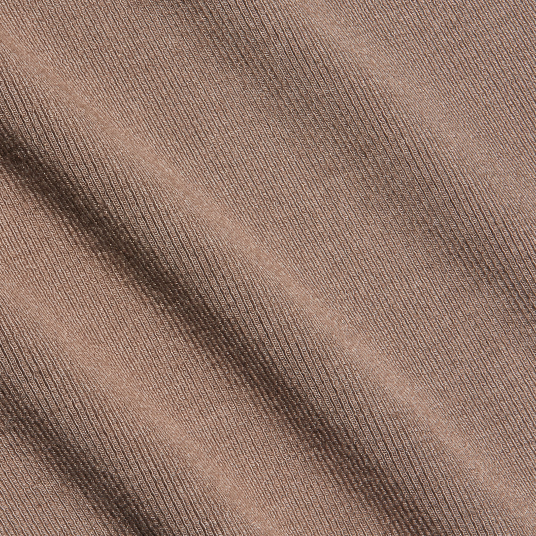 Close-up of the Lunara Camisole in brown micro modal ribbed fabric, featuring diagonal textured lines across the surface.