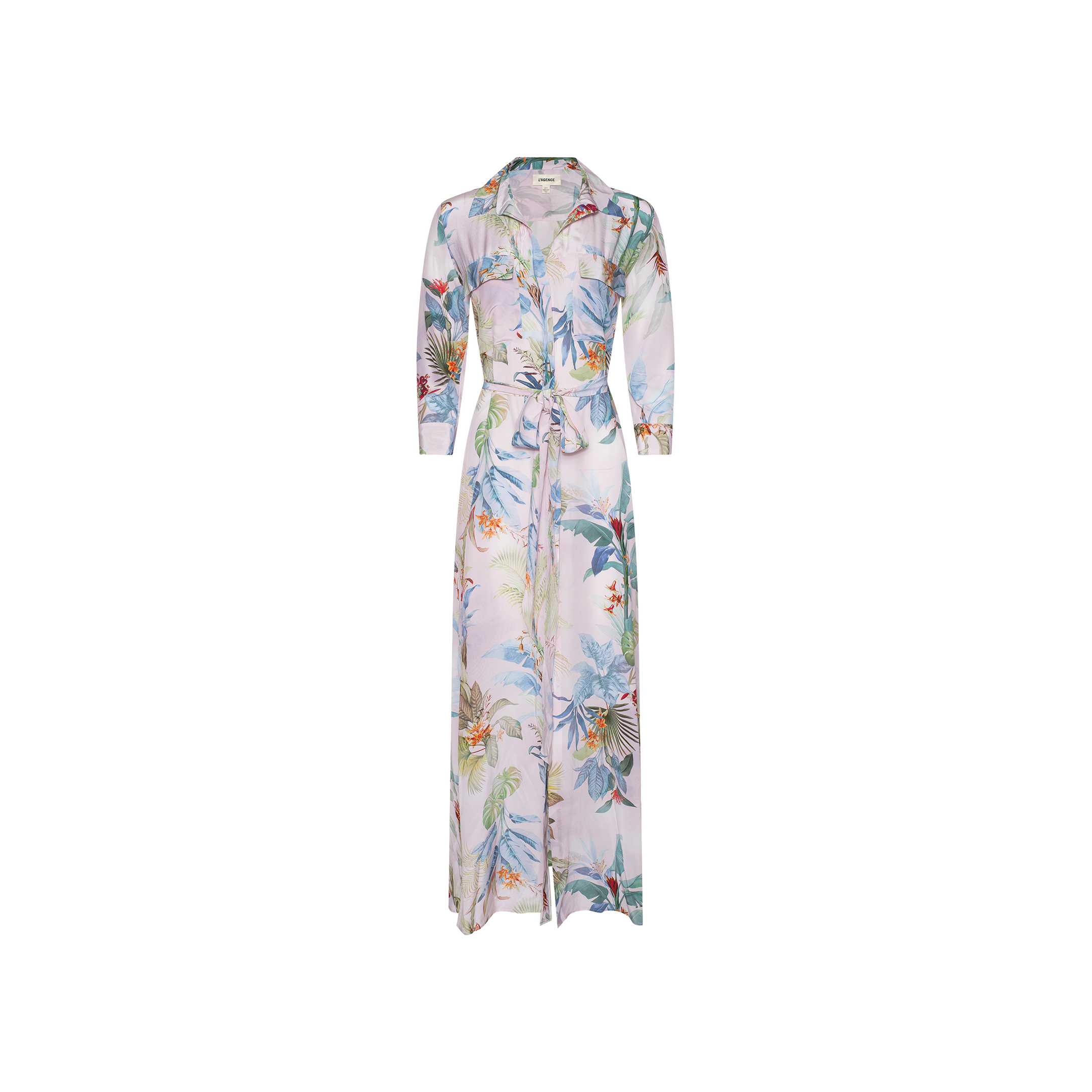 The Cameron Silk Shirt Dress is a long, sheer silk crepe de chine dress featuring a colorful palm leaf and floral print. It includes a button-down front, collar, long sleeves, and a tied waist belt, and is displayed on a plain white background.