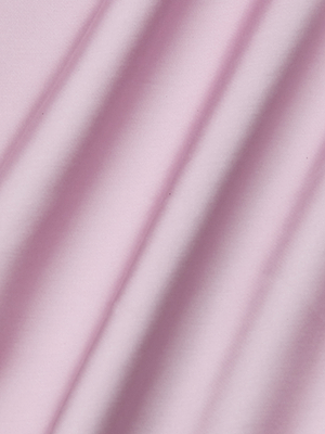 The Akiya Satin Maxi Dress features soft pink fabric with gentle diagonal folds and shadows, reminiscent of bias-cut satin, creating a smooth and elegant texture.