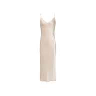 The Seridie Silk Slip Dress is a sleeveless, light beige champagne silk dress featuring thin spaghetti straps and a V-neckline, designed in a bias-cut silk silhouette and shown against a plain white background.