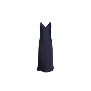 The Seridie Silk Slip Dress, shown against a plain white background, features a navy blue hue, thin spaghetti straps, and a V-neckline. Crafted in lustrous silk with a bias cut, it creates an elegant and flattering silhouette.