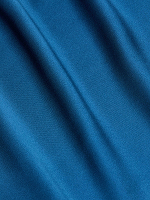 Close-up of the Zaria Silk Mini Dress in smooth blue charmeuse, featuring gentle diagonal folds and a soft sheen for a luxurious, elegant texture.