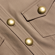 Tan stretch twill Cori mini dress featuring large gold-tone hardware buttons on the front placket and chest pocket flap.