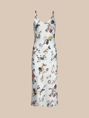 The Anika Slip Dress is a white sleeveless midi dress with thin straps, showcasing a vibrant print of fans, masks, and decor on a beige background—ideal for an elegant evening look.