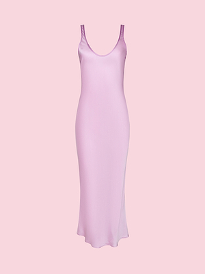 The Akiya Satin Maxi Dress, a sleeveless floor-length pink dress with a scoop neckline, is shown on a plain pink background and takes inspiration from the Legally Blonde capsule collection.