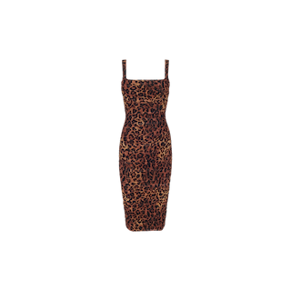 The Anya Shirred Dress is a sleeveless, form-fitting midi dress featuring a leopard print, square neckline, and narrow shoulder straps. Crafted from shirred mesh, it is displayed against a plain white background.