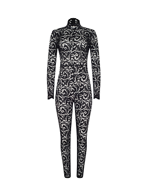 The Zahara Lace Catsuit by L'AGENCE is a black, long-sleeve, full-length stretch catsuit with a high neck and intricate white floral lace pattern—perfect for elevating your night-out look. Shown on a plain white background.