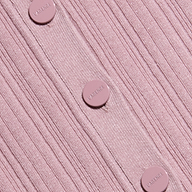 Close-up of the Domino Dress, a ribbed, light pink lightweight knit featuring five matching pink buttons embossed with the word LARENCE, sewn vertically down the garment.