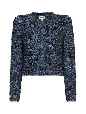 The Una Knit Cardigan by L'AGENCE is a fuzzy, textured eyelash knit navy blue cardigan featuring long sleeves, front buttons, two front pockets, and a cozy multitone blue design.