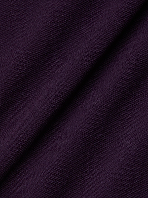 Close-up of the Azia Cutout Knit Top by L'AGENCE shows its dark purple, textured power knit fabric with a soft weave and subtle sheen, making it perfect for creating a fitted silhouette.