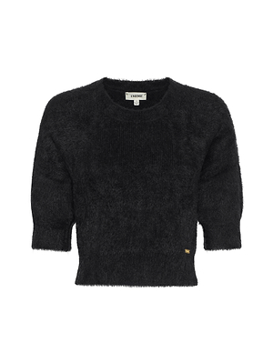 The Guinevere Cropped Pullover by L'AGENCE is a black, ultra-soft knit crewneck sweater with short sleeves and a ribbed hem, shown against a plain white background.