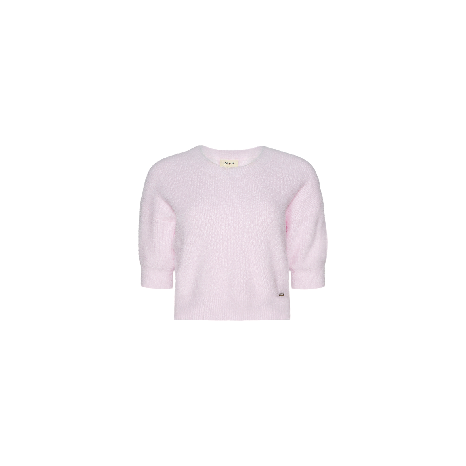 The Guinevere Cropped Pullover is a light pink, short-sleeve crewneck sweater crafted from soft, textured fabric. Featuring a relaxed fit and a small tag near the bottom hem, this pullover is displayed on a plain white background.