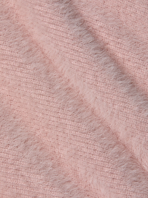 Close-up of the Guinevere Cropped Pullover’s ultra-soft pink knit fabric, featuring a fuzzy, textured surface with diagonal ridges—ideal for a cozy crewneck sweater.