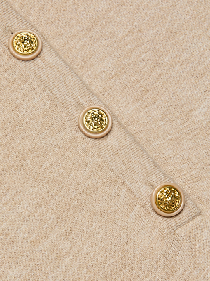 Close-up of the Ronda Knit Henley Top in beige, featuring lightweight knit fabric and a diagonal row of three decorative gold buttons for a chic, Henley-inspired style.