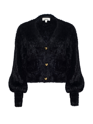 The Harriet Cardigan by L'AGENCE is a black fuzzy knit with a cropped fit, long puffed sleeves, two front pockets, and three gold heart-shaped buttons down the center.