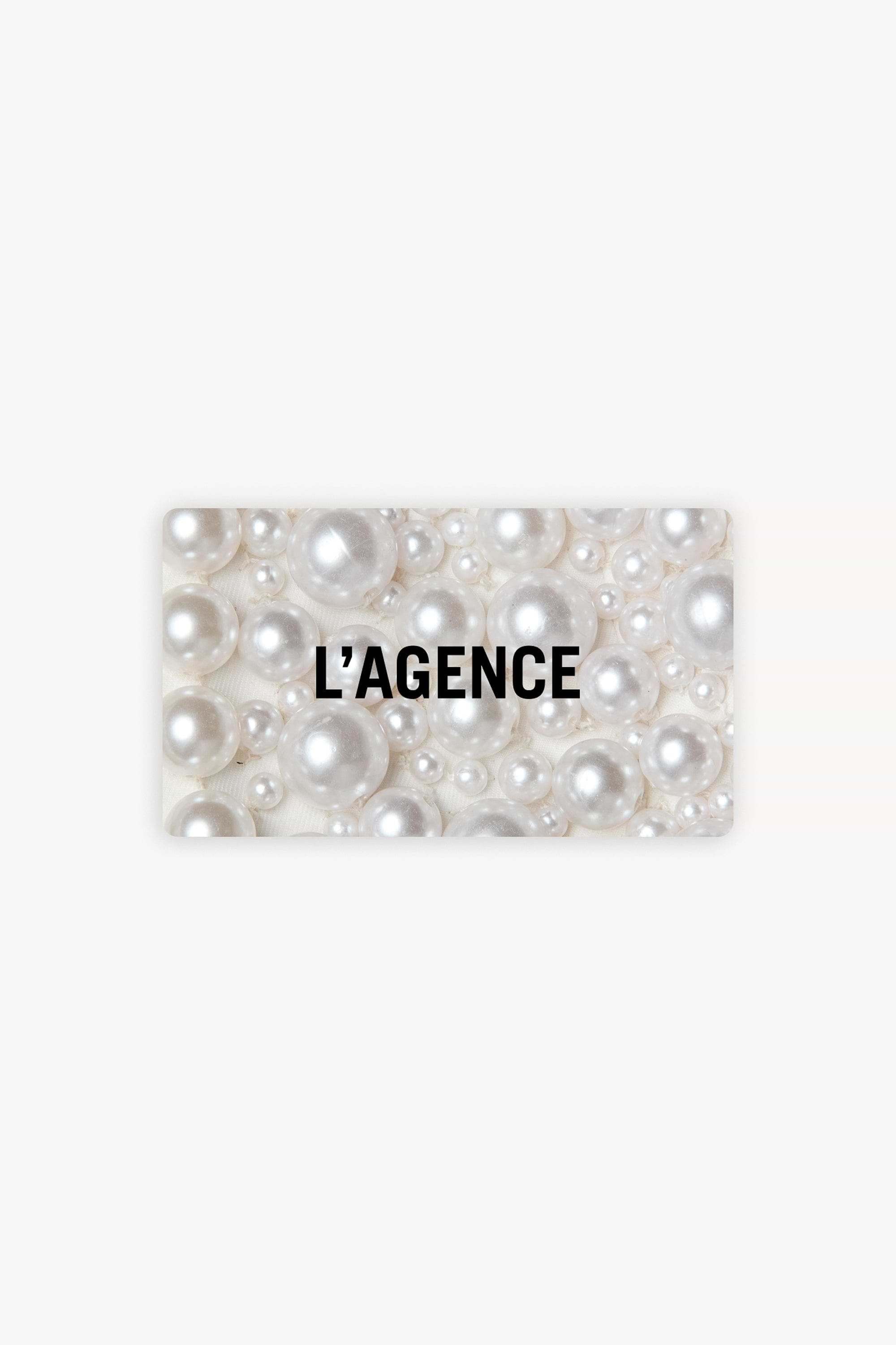 A rectangular card with a background of variously sized white pearls and the black text L’AGENCE centered on it.