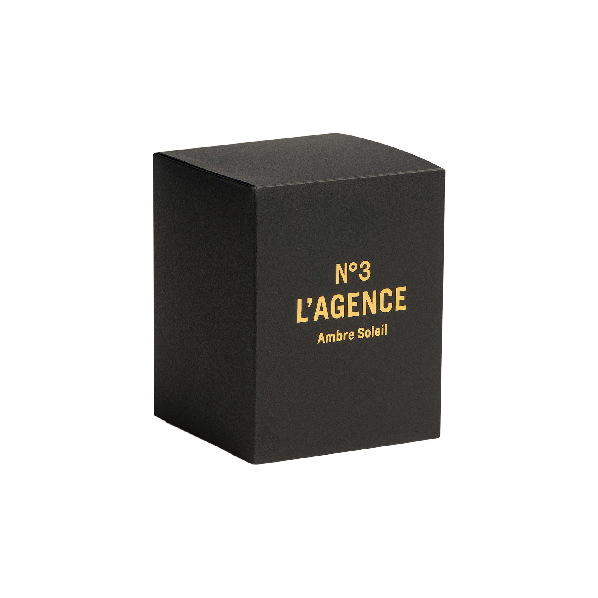 A sleek black box featuring gold text that reads “Ambre Soleil” is displayed against a clean white background. This sophisticated packaging contains hand-poured Ambre Soleil candles, made from a carbon-neutral soy blend to ensure a long burn time and deliver an indulgent fragrance experience.