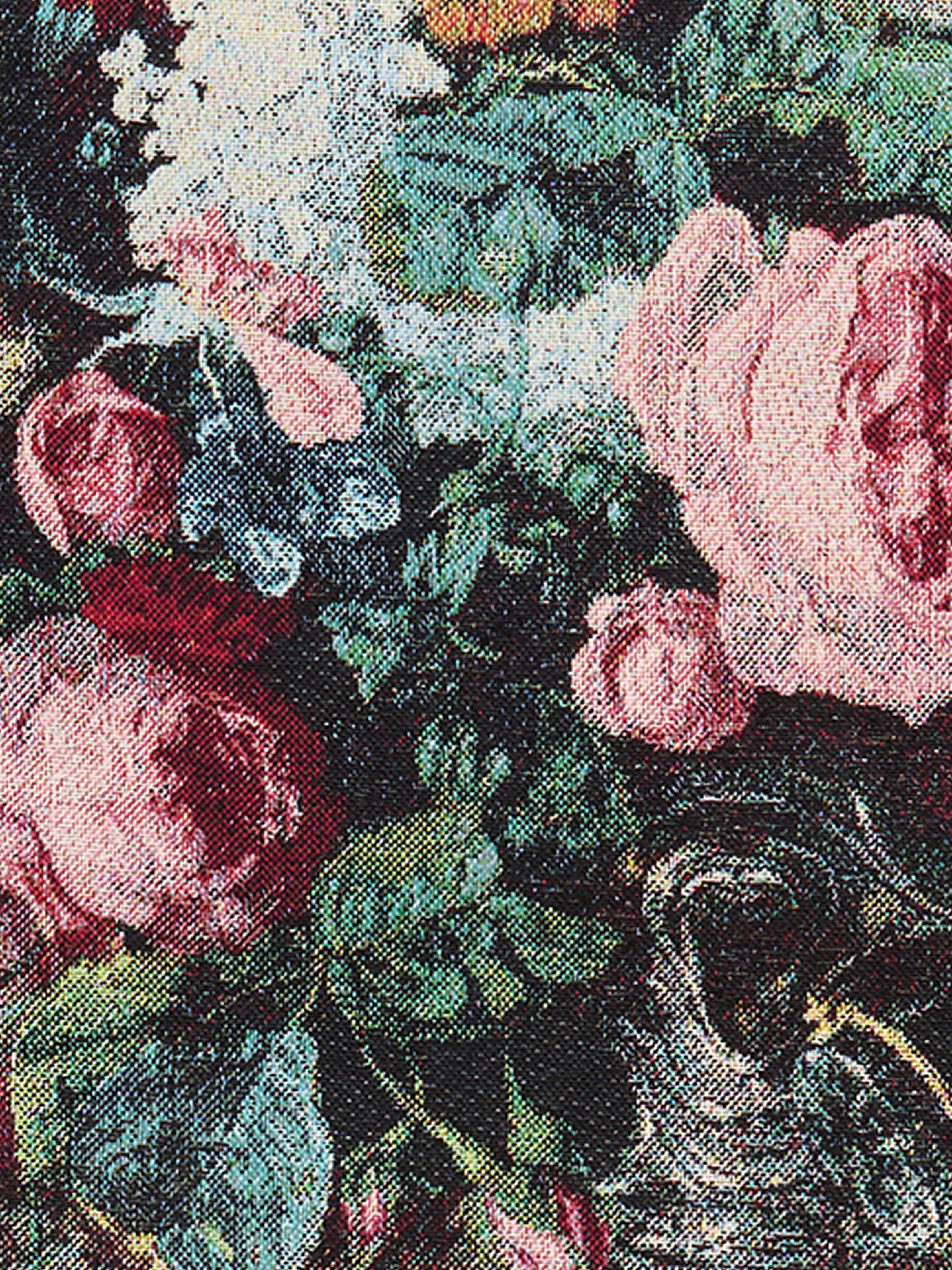 Detailed close-up of a woven tapestry featuring pink roses, blue flowers, green leaves, and floral patterns, showcasing the textured stitching and vibrant colors.