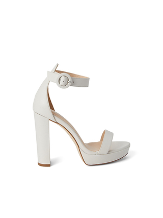The Cecile Platform Sandal, featuring a white block heel, an ankle strap with a round buckle, and a single toe strap, is displayed in side profile against a white background.