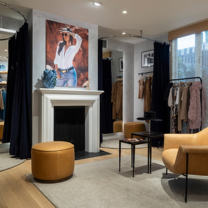 Modern interior design showroom with furniture and clothing display