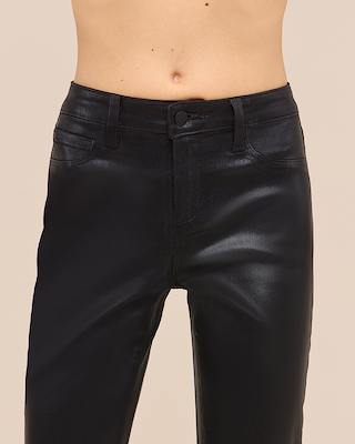A person wearing high-waisted, black, faux leather pants. The image shows the pants from the waist to the mid-thigh against a plain background.