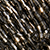 Close-up of metallic, cylindrical beads arranged in vertical rows.