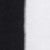 A close-up image showing a vertical split with solid black on the left side and solid white on the right side.