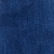 Vue rapprochée dun tissu denim bleu, montrant son motif de tissage texturé et de légères variations de couleur typiques de la matière des jeans.