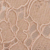 Close-up of beige lace fabric with a floral pattern, showing delicate embroidery and sheer sections.