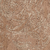 A close-up of a weathered, textured tan stone surface.