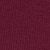 A close-up view of a textured fabric surface in a deep maroon or burgundy color. The texture shows a woven or knitted pattern throughout.