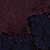 An abstract, dark textured surface featuring a deep red upper section and a navy blue lower section divided by an irregular, jagged line.