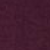 A close-up of a textured surface in a dark maroon or burgundy color, with subtle variations in shading and a slightly rough appearance.