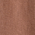 A close-up view of a brown, slightly textured surface with subtle vertical lines and shading variations.