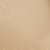 Close-up of a beige, textured surface with a subtle pattern resembling leather or vinyl material. The texture consists of small, irregularly shaped bumps and lines.
