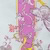 Abstract pattern featuring a vertical pink stripe with yellow edges and swirling line designs, alongside outlined floral motifs in purple, pink, and yellow on a pale background.
