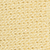 A close-up view of a honeycomb pattern in a light yellow color, resembling beeswax with hexagonal cells evenly arranged across the surface.
