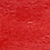 A red surface with white spots.