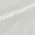 Primo piano di una superficie liscia di marmo grigio chiaro con sottili venature bianche che la attraversano in diagonale. La texture appare lucida e leggermente riflettente.