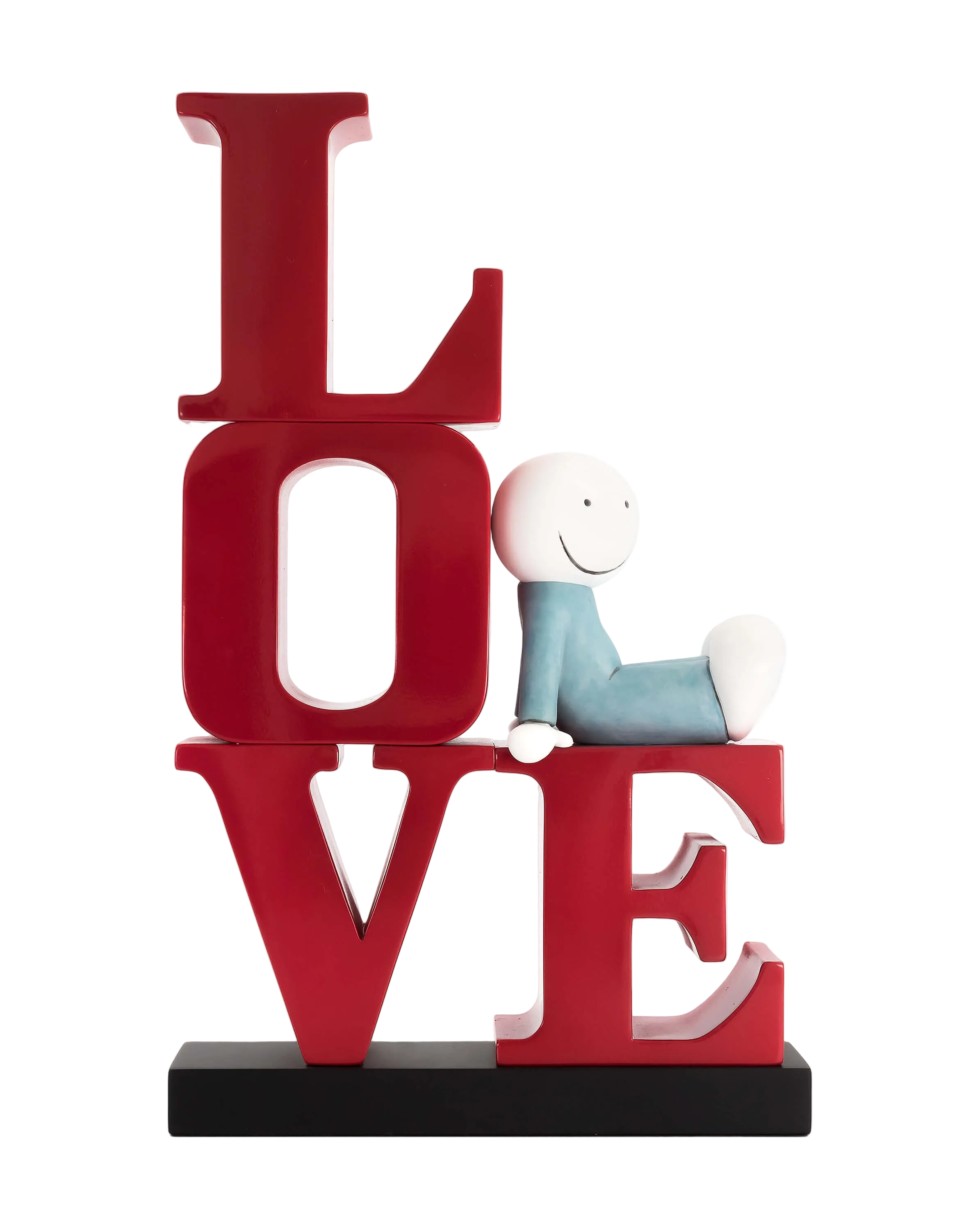 A sculpture featuring the word 'LOVE' in bold red lettering with a smiling character sitting on the letter 'E' appearing to be enjoying a book.