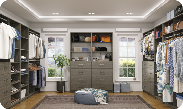 Large grey Alto walk-in featuring mutli-tier hanging, slanted shoe shelves, and drawers.