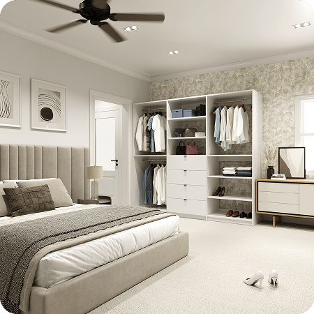 Open white reach-in wardrobe with double hanging, 4 center drawers, and handbag shelving again floral wallpaper in a modern neutral bedroom