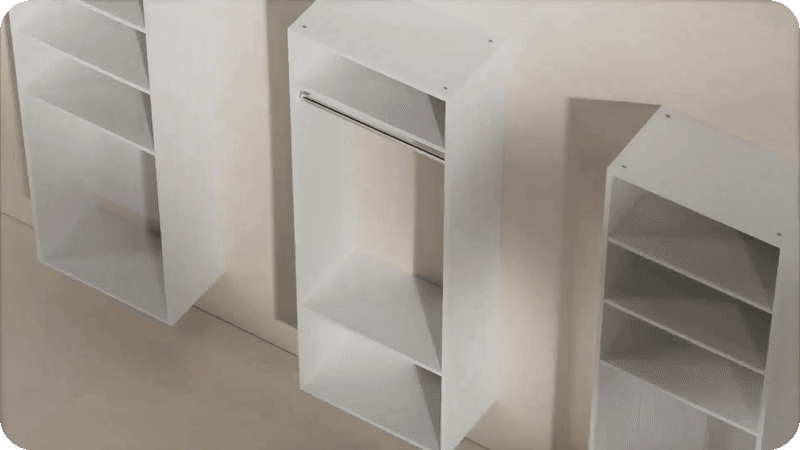 Animation showing white shaker closet units floating into place to form a custom storage system