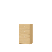 Natural oak closet drawers with slab fronts for dresser in closet storage in small apartments.