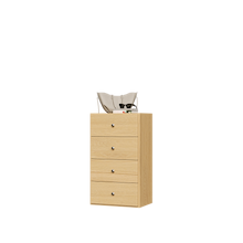 Natural oak closet drawer unit with slab fronts for large closet storage.