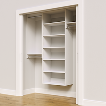 White 64.5-inch Vista Total Closet Kit, angled view, empty, with tall hanging in a reach-in closet