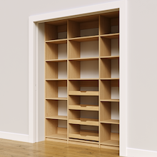 Four wood pull-out drawers in 66 inch natural oak pantry.